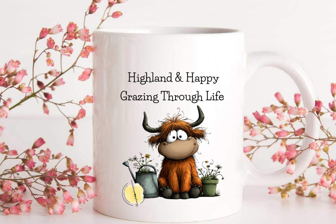 White mug with cartoon Highland cow and floral design on a white background