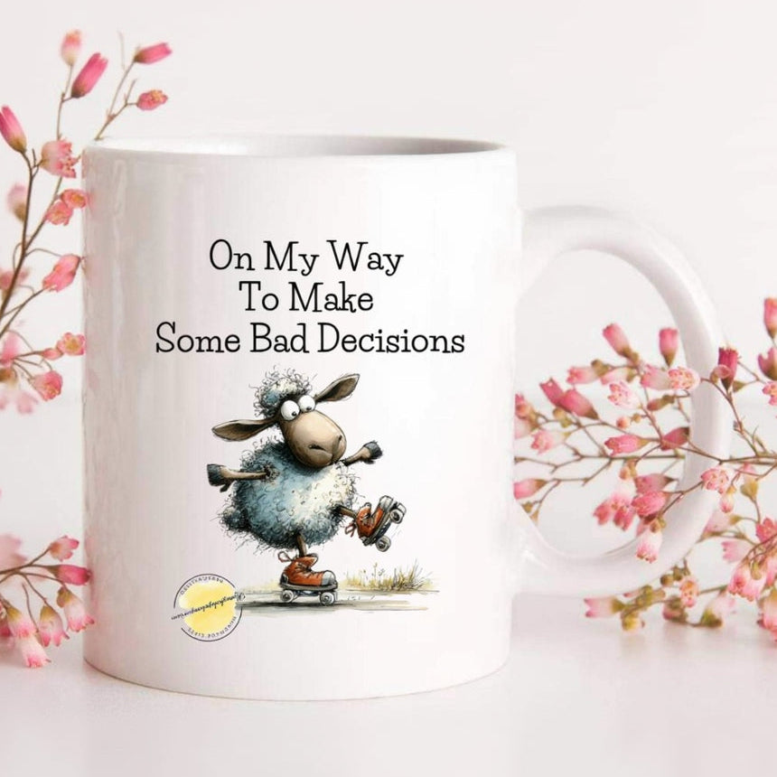 Mug with cartoon sheep and humorous text on a white background with pink flowers.